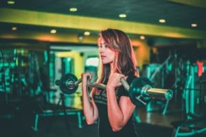 Woman lifting weights at the gym, Best Meal Prep Vancouver