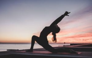 woman doing Yoga at sunrise, Food Delivery Vancouver